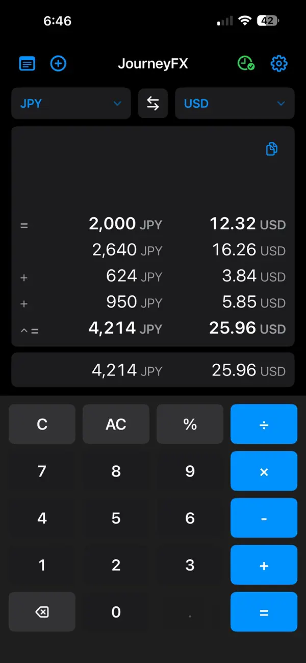 JourneyFX calculator converting Japanese yen to US dollars in dark mode